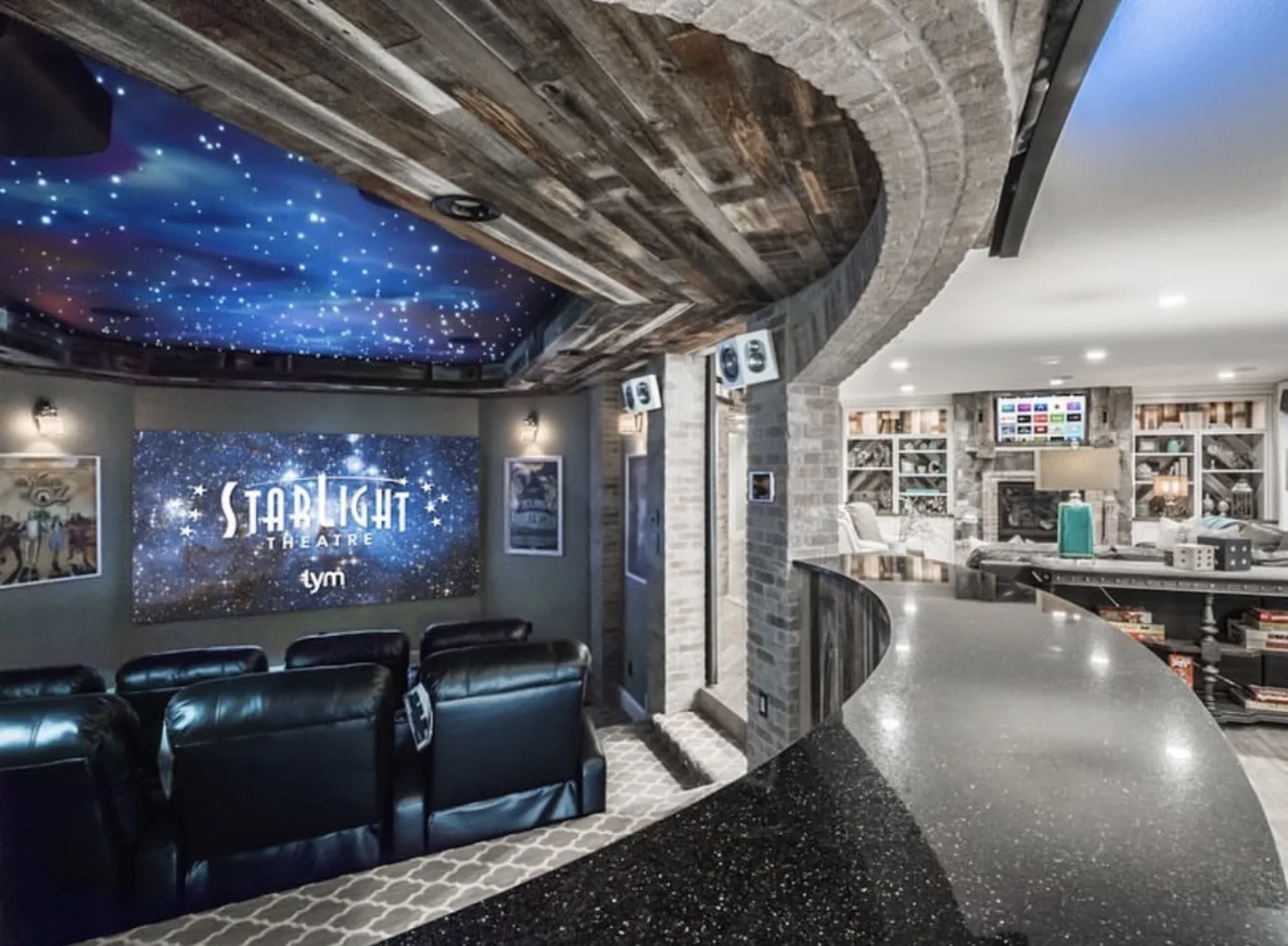 Open-concept home theater — Starlight Theatre — with star ceiling and stone details